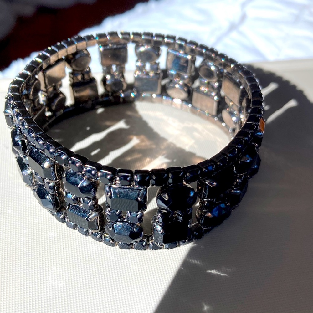 Stretch puzzle bracelet. Black prong set lucite stones. As perfect as new.